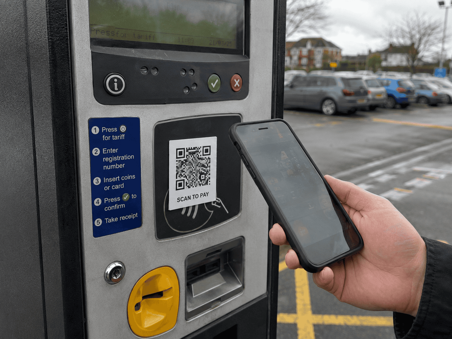 phone payment being made with QR code at car pay station