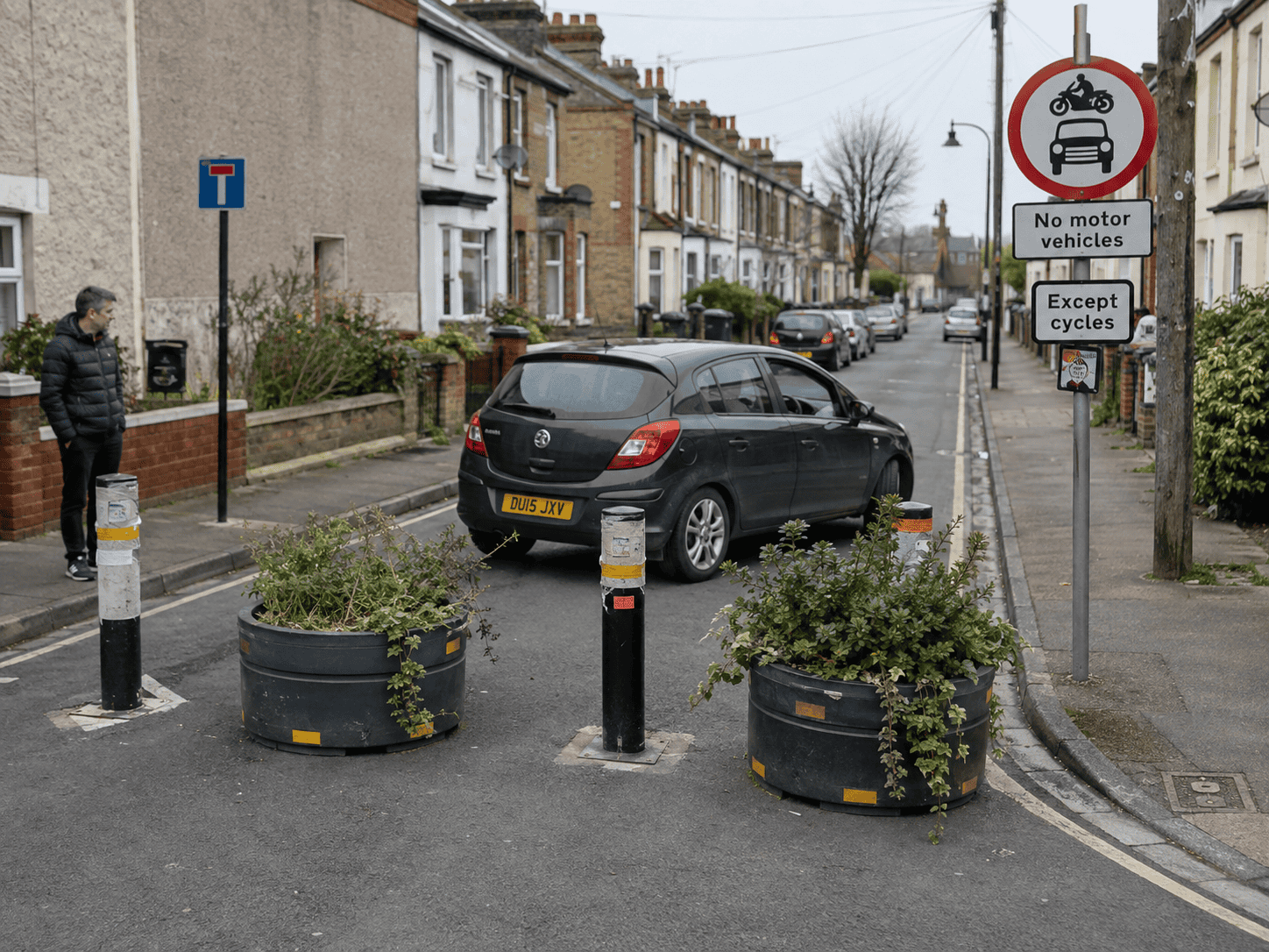 Hatchback carefully turning through a low-traffic neighbourhood area