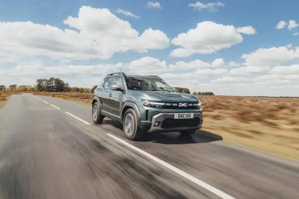 Dacia Duster Hybrid 155 driving on a rural road