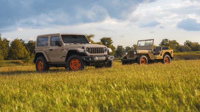 2027 Jeep Wrangler JL-2A special edition parked next to a restored Willys CJ-2A in a field