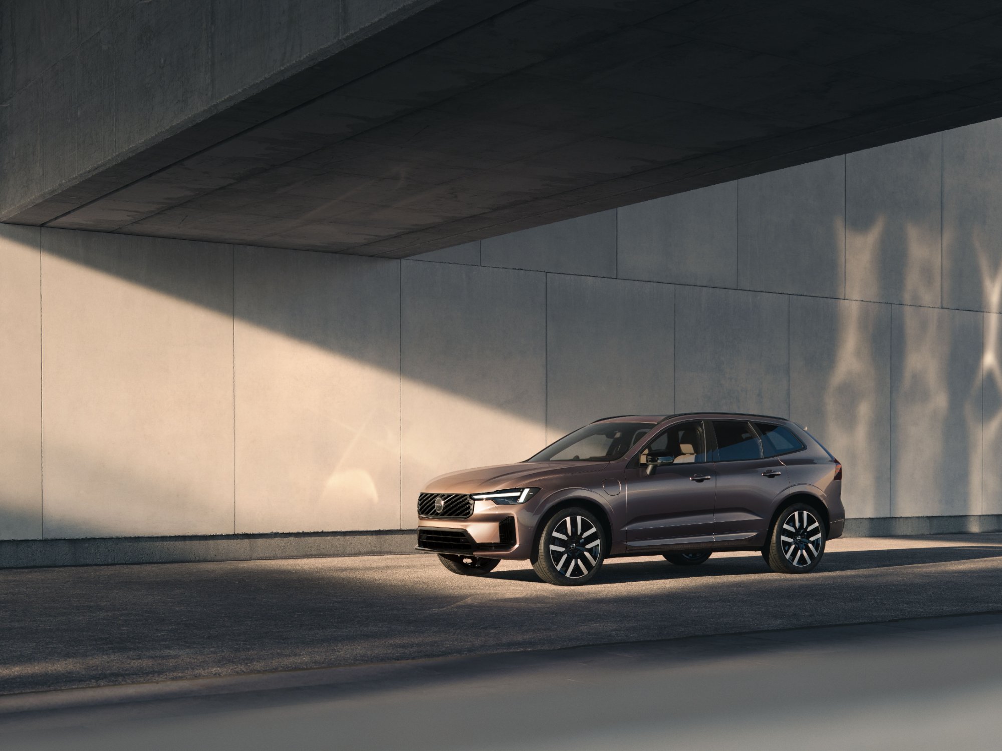 The new Volvo XC60 plug-in hybrid parked under a concrete structure