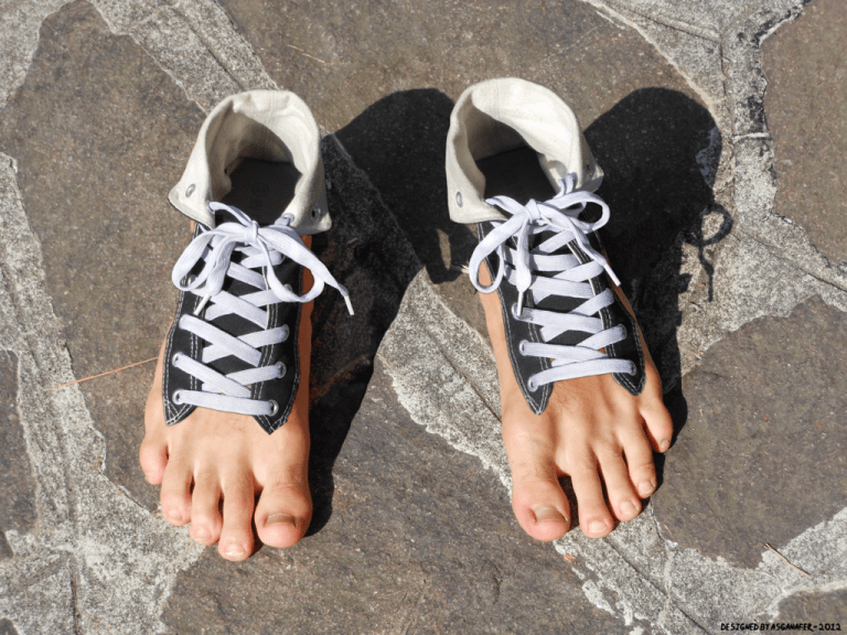 A pair of bare feet finding pain relief and promoting recovery on a stone floor for better health and wellness.