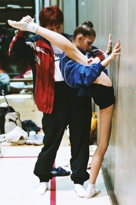 A girl is performing a gymnastics routine in a gym, focusing on her recovery and health.