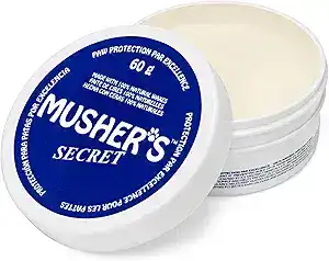 Musher’s Secret paw wax that protects dry, irritated paws and helps reduce excessive paw licking in dogs.