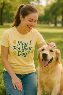 Woman petting a golden retriever dog with a yellow shirt and in green cursive writing says May I pet Your Dog?