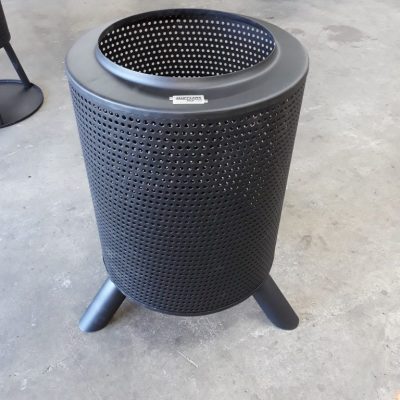 Mufflers.nz-perforated black metal trash can with three legs for outdoor use.