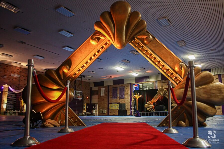 red carpet with a gold structure at the entrance
