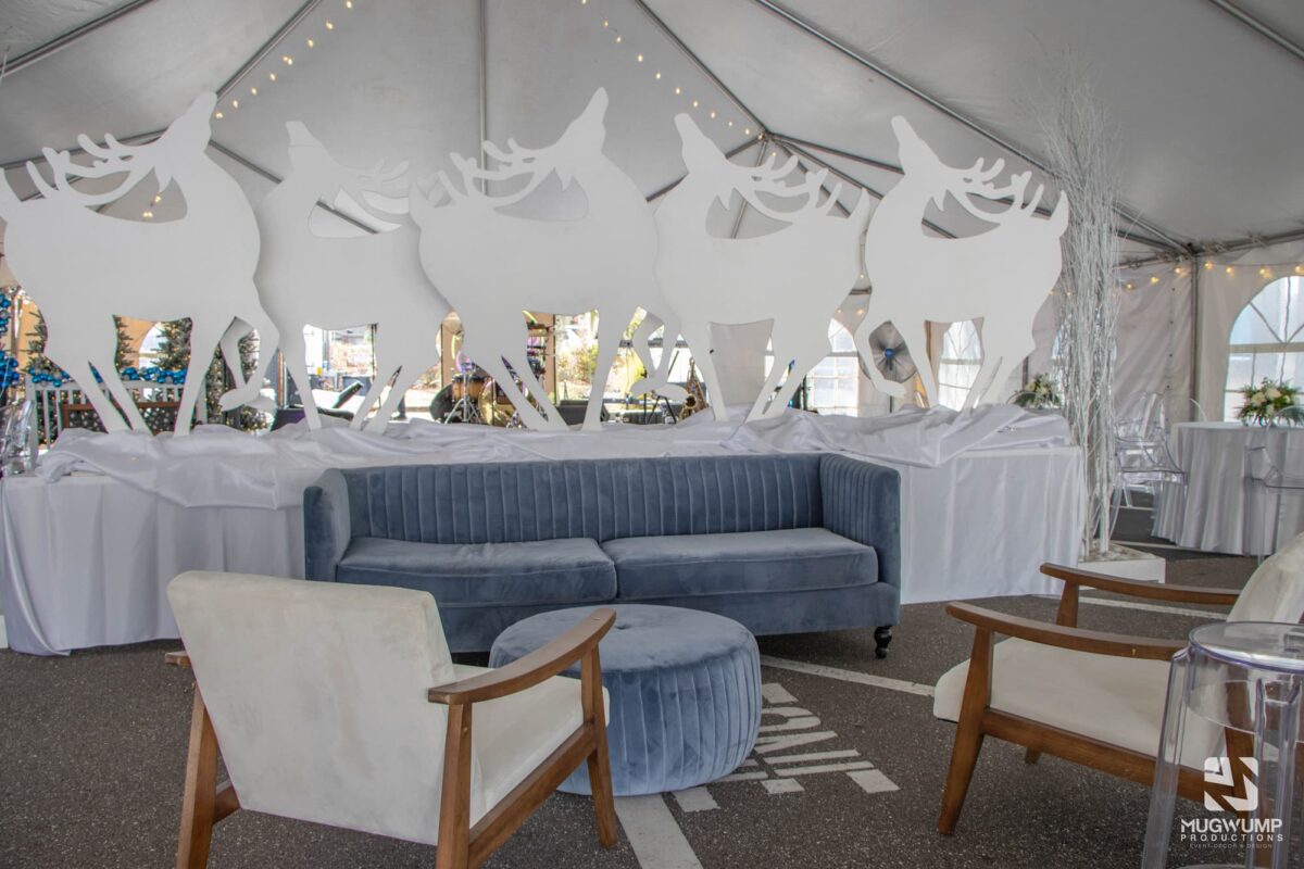 Holiday-Party-Decor-Blue-Couch-Reindeer-Backdrop