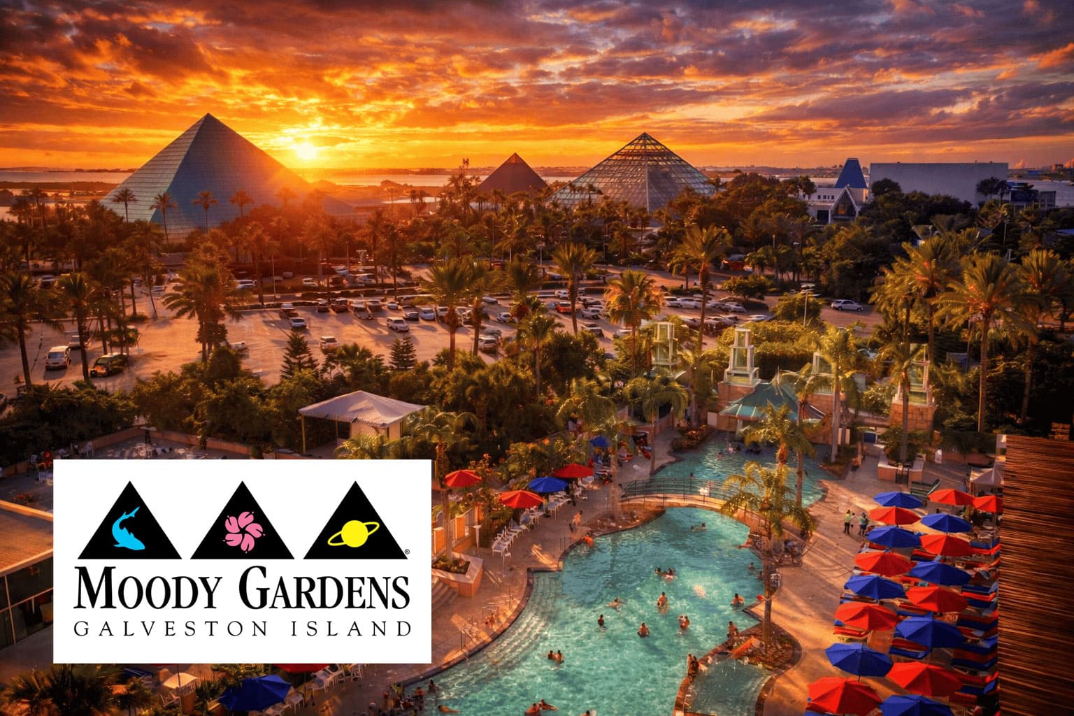Sunset over Moody Gardens with pyramid structures and pool area in Galveston Island.
