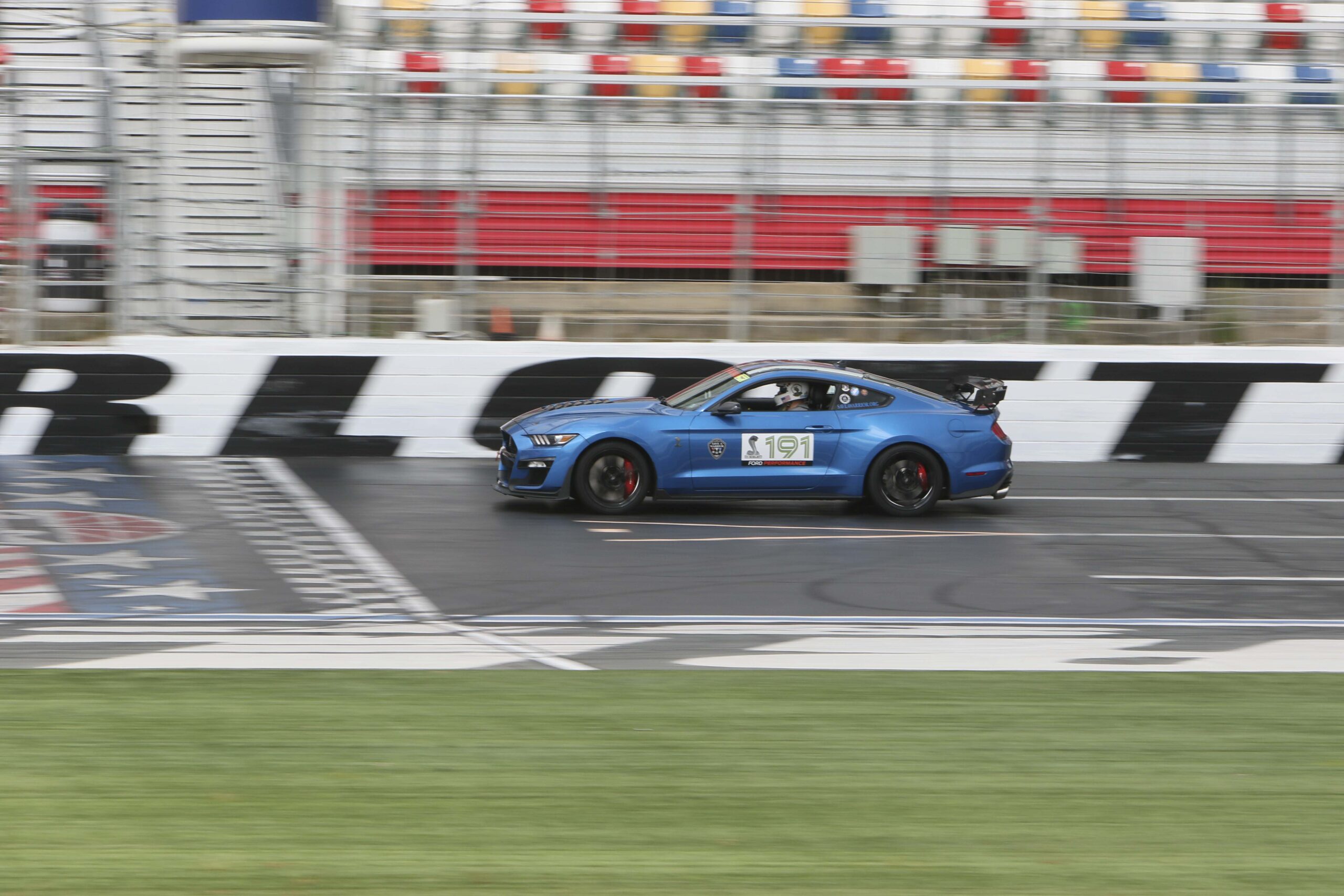 Blue race car with number 491 on a race track at Charlotte 2026.