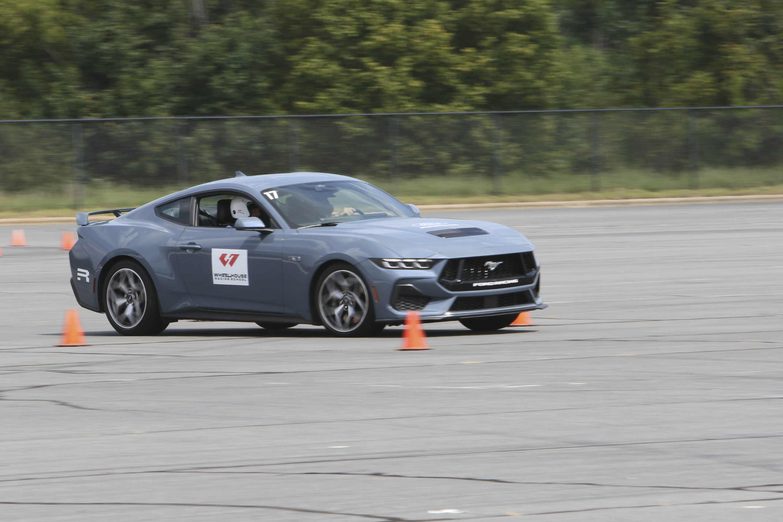 Gray Ford Mustang driving through an autocross course at Mustang Week Charlotte 2026.