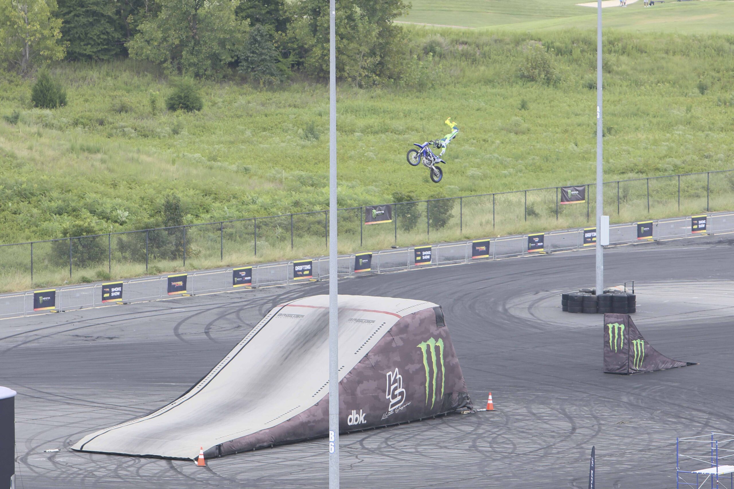 Motocross rider performing a jump at Mustang Week event.