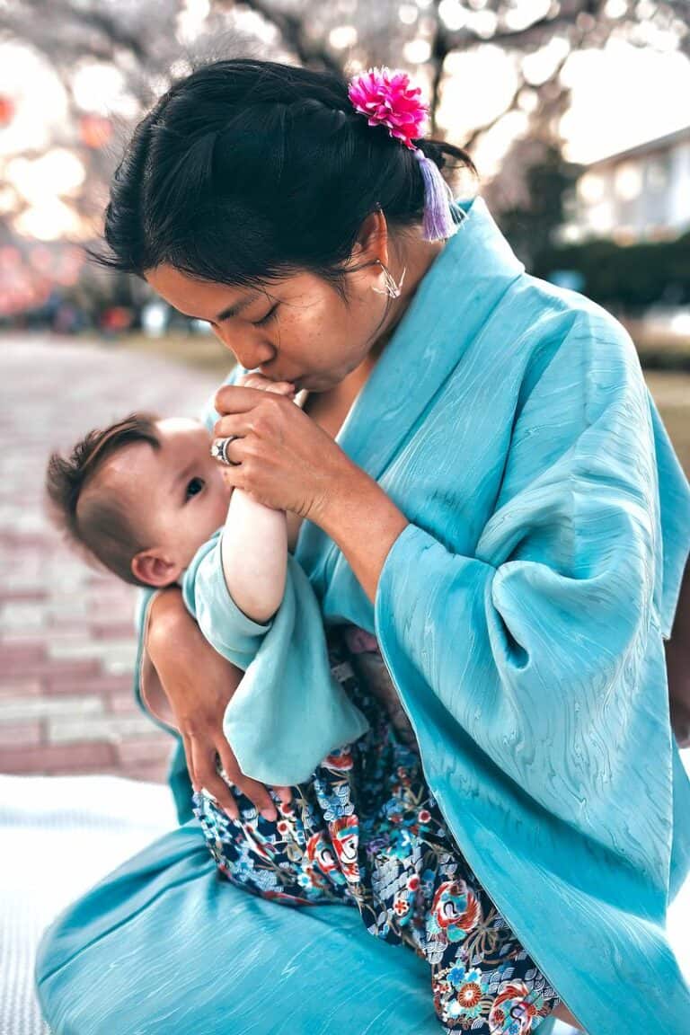 Dr. Samantha Mikals breast feeding her child