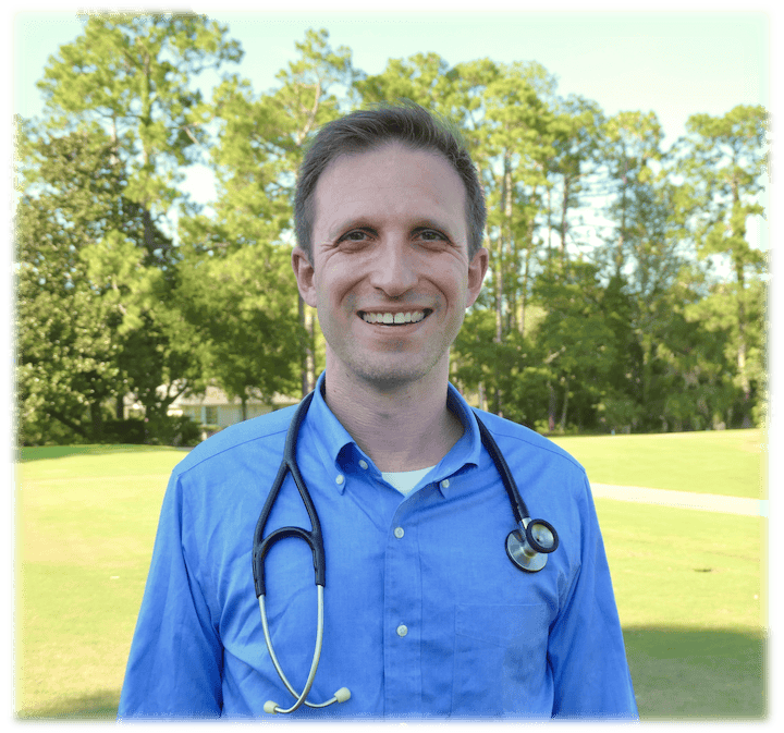 Dr. Kyle Mikals weraing a lab coat and stethescope