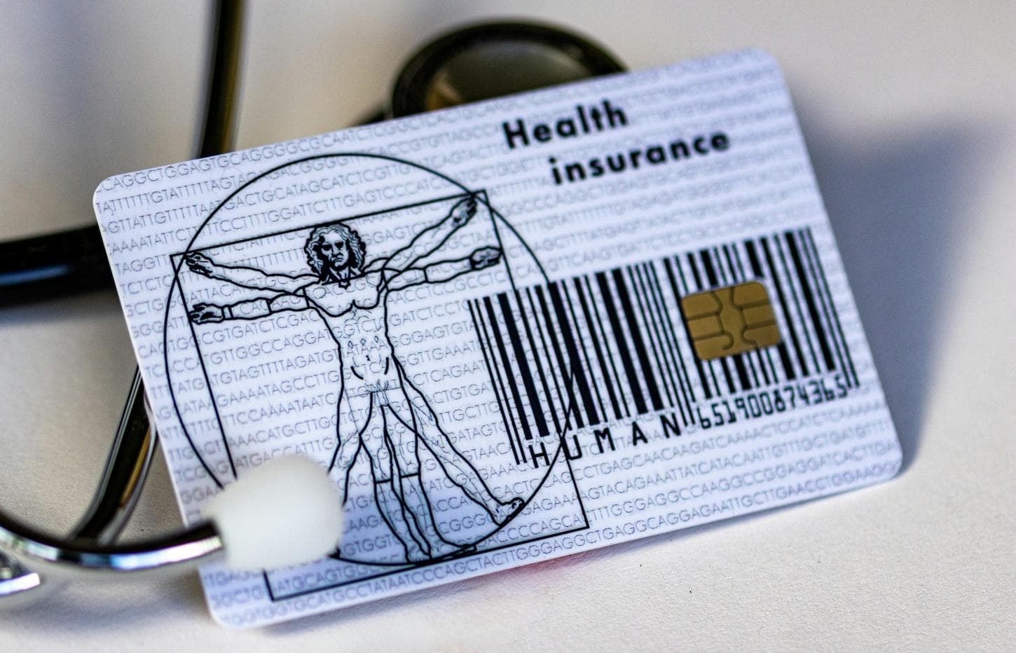 a picture of a generic health insurance card and stethoscope