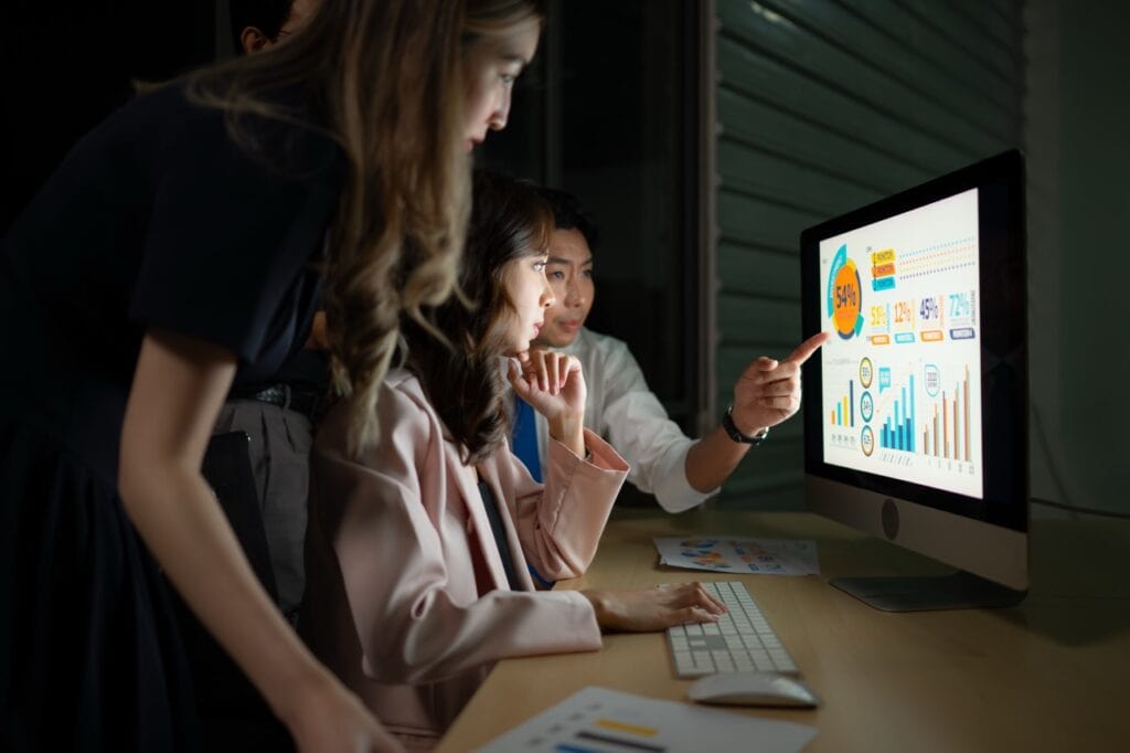 Group of business people working in office at night. business concept.