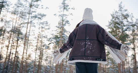 Person enjoying winter outdoors during Meridian Trust CD promotion.