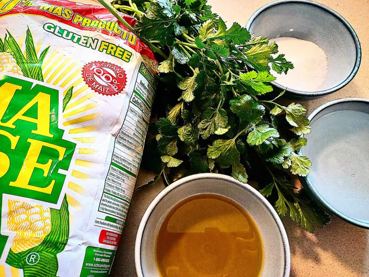 Ingredients on a bench top to make Mexican dumpling (Chochoyotes)