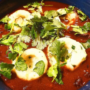 Venison, black bean chilli topped with 4 mexican dumplings and chopped coriander