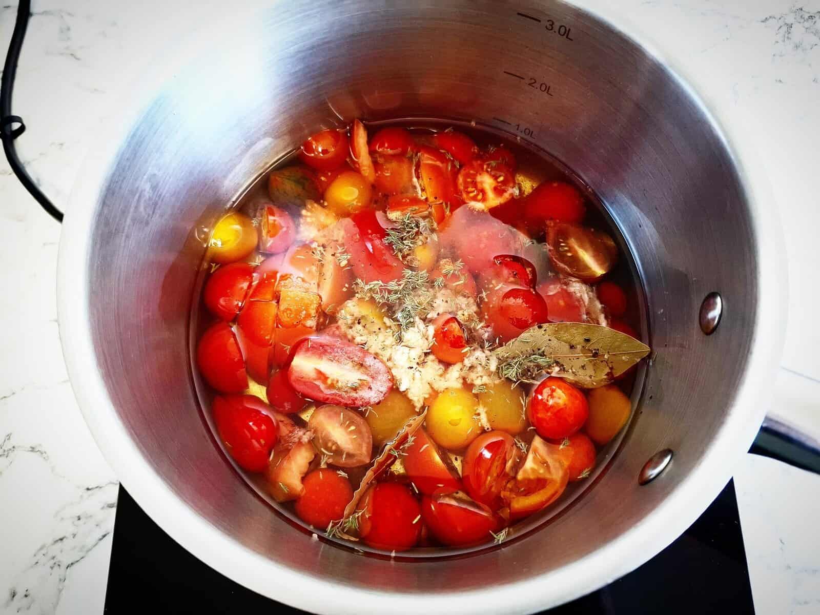 tomatoes, oil, garlic, thyme, bayleaves, salt and pepper in a saucepan