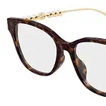 Tortoiseshell eyeglasses with pearl and gold details, perfect for stylish women.