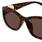 Gucci tortoise sunglasses with gold logo detail, stylish and high-quality eyewear.