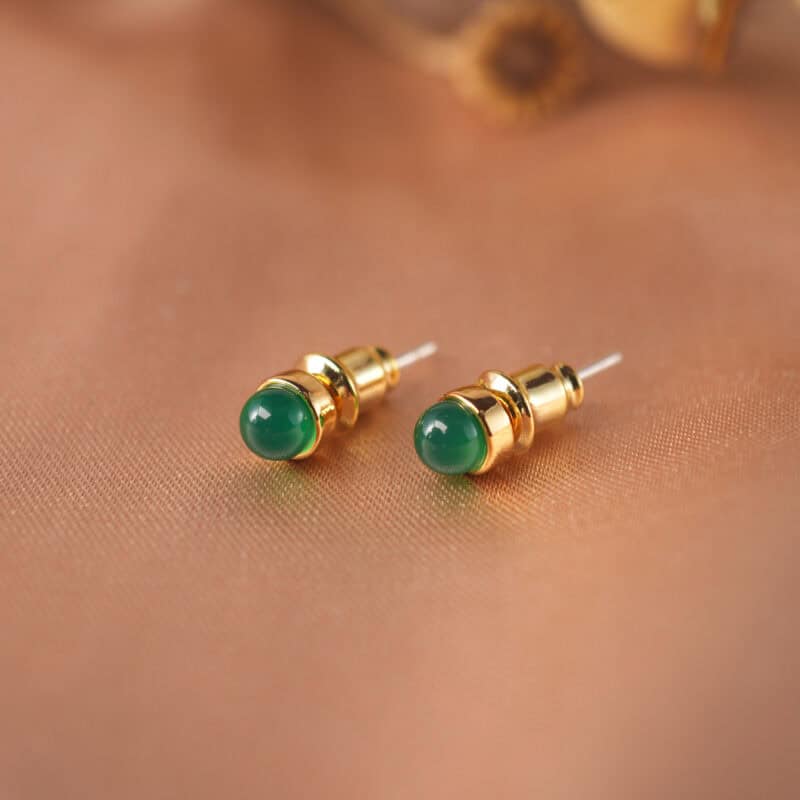 Pair of green agate mini stud earrings on a clean background