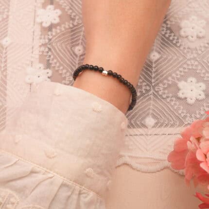 Bracelet worn on wrist, showing minimalist style and natural stone shine