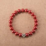 Handmade cinnabar bracelet with detailed red flower beads
