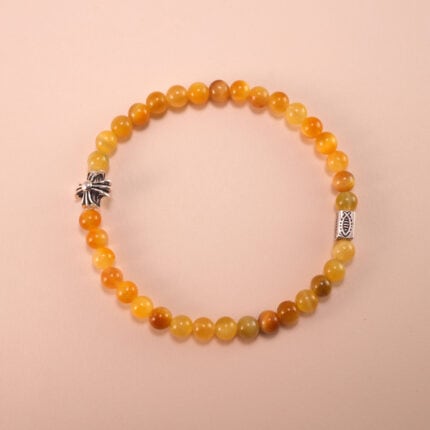 Tiger Eye 4mm bracelet on light background with reflective highlights