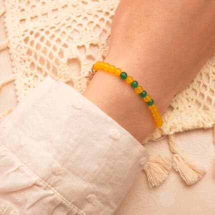 Worn on the wrist with natural light, styled with warm-toned outfit