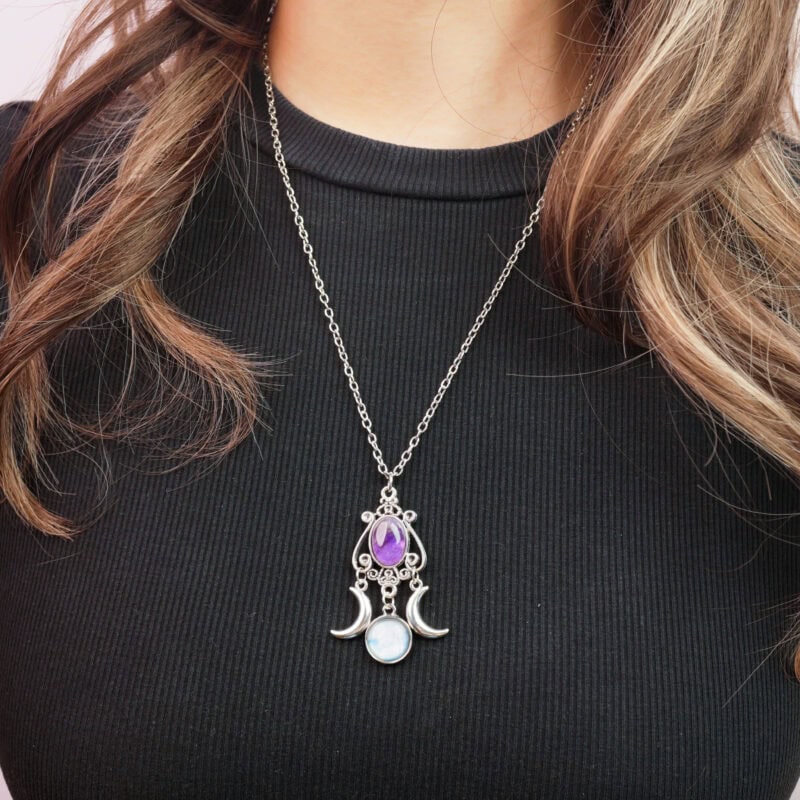 Model wearing the necklace, showing the pendant resting at the collarbone