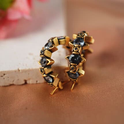 Antique bronze Saturn-shaped ear clips with black crystal