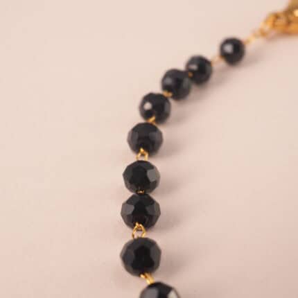 Close-up of genuine black tourmaline beads on adjustable bracelet