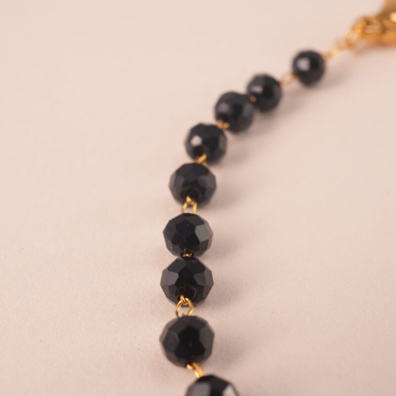 Close-up of genuine black tourmaline beads on adjustable bracelet