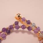 Detailed view of genuine amethyst beads highlighting natural purple hues and smooth surface