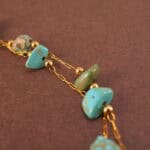 Detail of polished turquoise green beads and double-layer design
