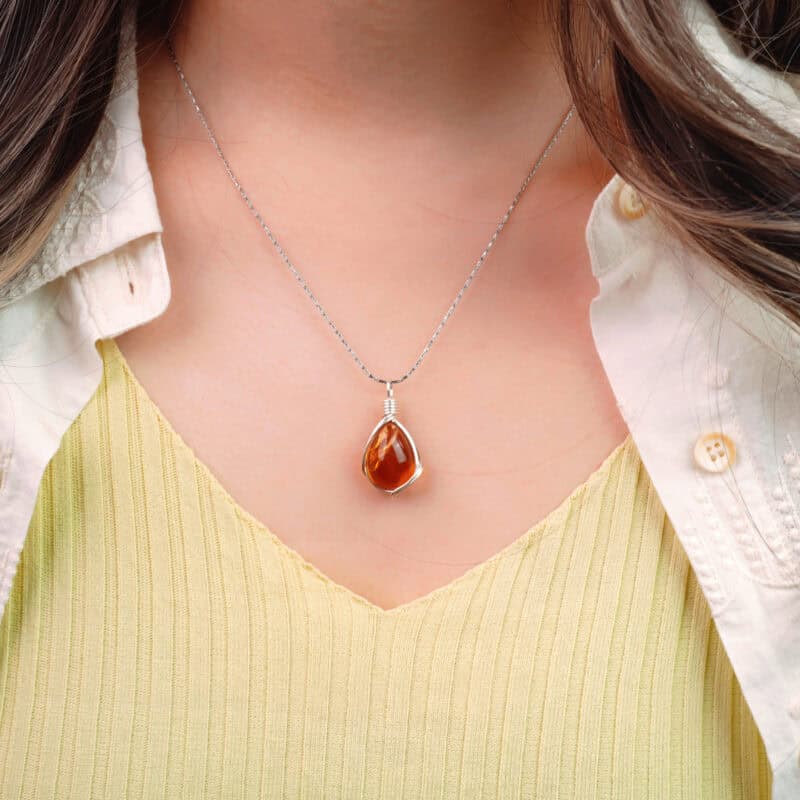 Model wearing the citrine necklace, showing pendant size and natural sparkle