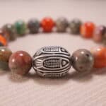 Close-up of natural stone beads and silver accents on beaded bracelet