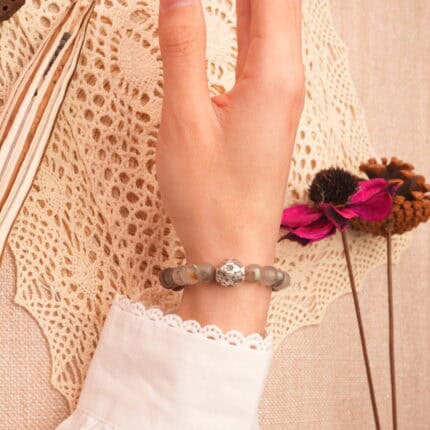 Bloodstone bracelet worn on the wrist, capturing its grounding and energetic appeal