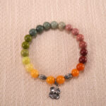 Colourful beaded bracelet with flower charm, handcrafted, vibrant design
