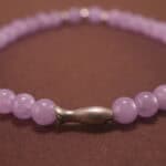 Detailed view of the amethyst beads showing their natural clarity and rich lavender hues