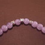 Detailed view of the amethyst beads showing their natural clarity and rich lavender hues
