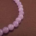 Detailed view of the amethyst beads showing their natural clarity and rich lavender hues