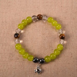 Trio crystal bracelet featuring chalcedony, tiger eye, and clear quartz arranged in a balanced design