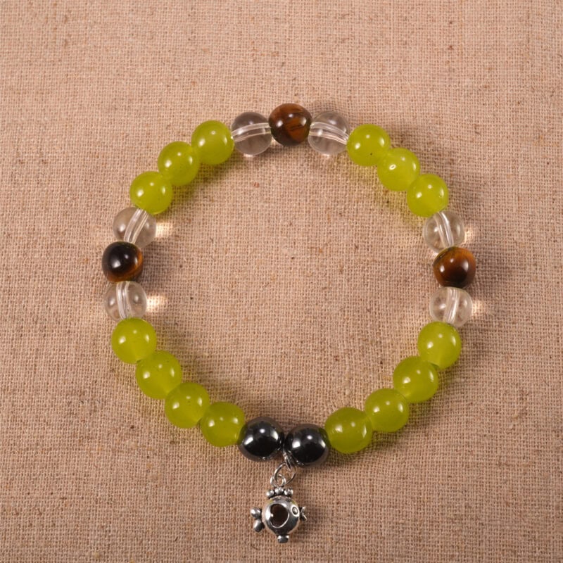 Trio crystal bracelet featuring chalcedony, tiger eye, and clear quartz arranged in a balanced design