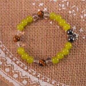 Bracelet placed in a soft-lit, natural setting with calming tones