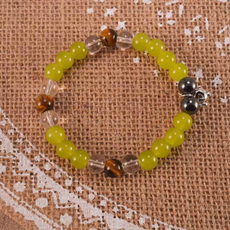 Bracelet placed in a soft-lit, natural setting with calming tones