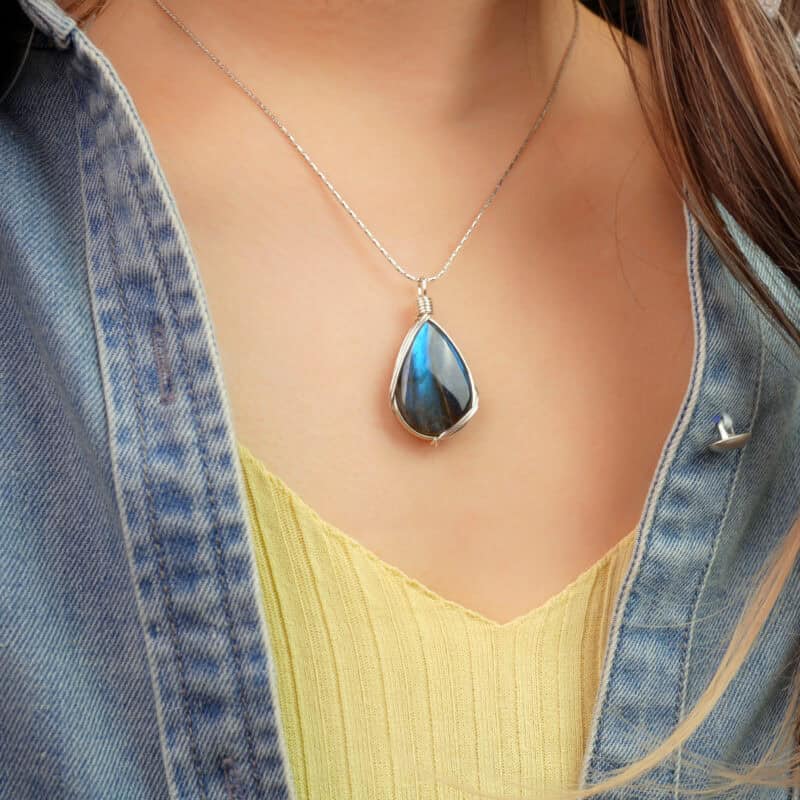 Model wearing the labradorite pendant, showing size and glow at the collarbone