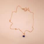 Handmade lapis lazuli pendant necklace displayed on neutral background